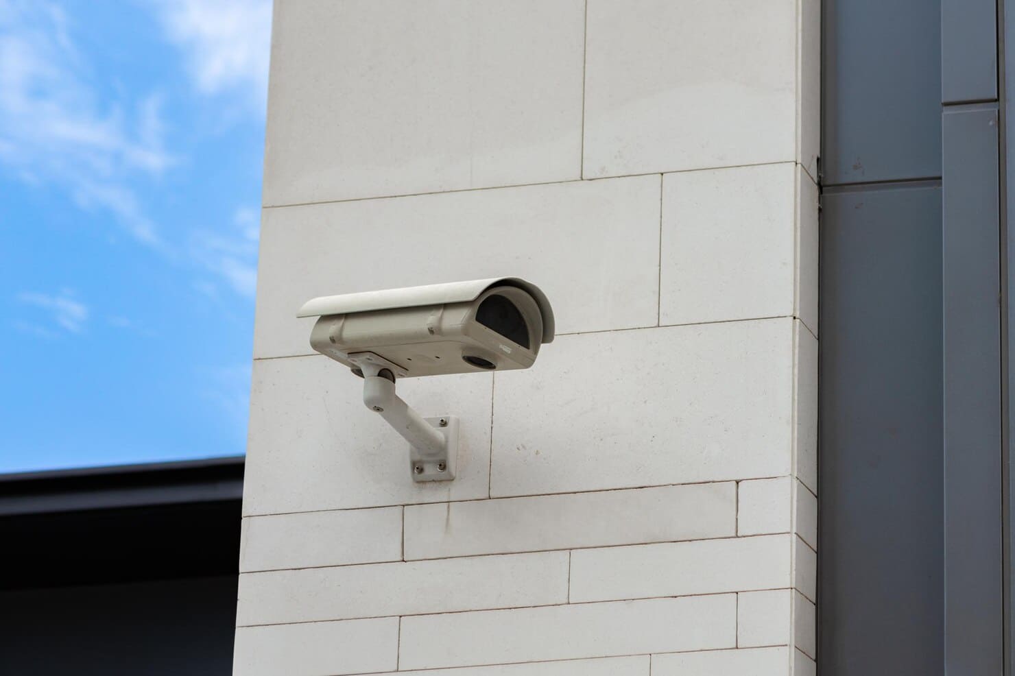 Illustrative building-mounted security camera